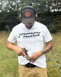 White AOG shirt worn on the range while drawing from an AOG holster